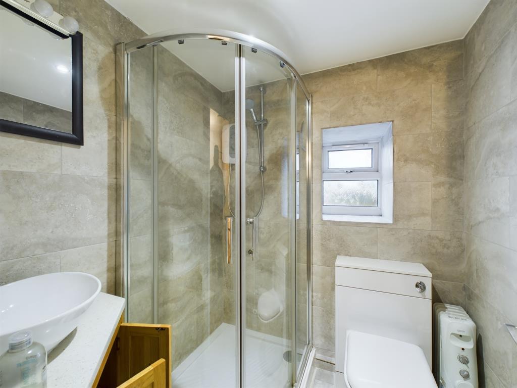 Lot: 139 - CHARACTER COTTAGE WITH GARDEN AND OFF-ROAD PARKING - Shower room with W.C. and wash basin